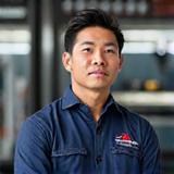 Portrait of Liam Tan, Lead Diagnostic Specialist at Apex Autosmith.